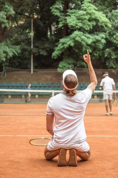 Old Fashioned Tennis Player Gesturing Kneeling Winning Match Court — стоковое фото
